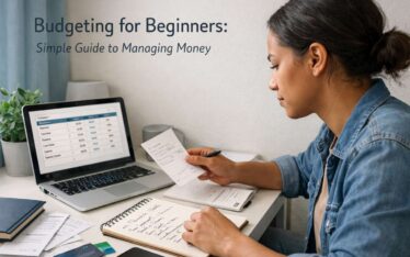 Beginner organizing budget on laptop with notes and expense tracking setup